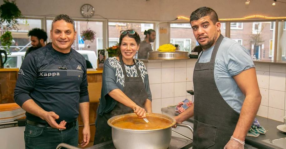 Visitors and volunteers enjoy a free lunch daily at BOOST Amsterdam